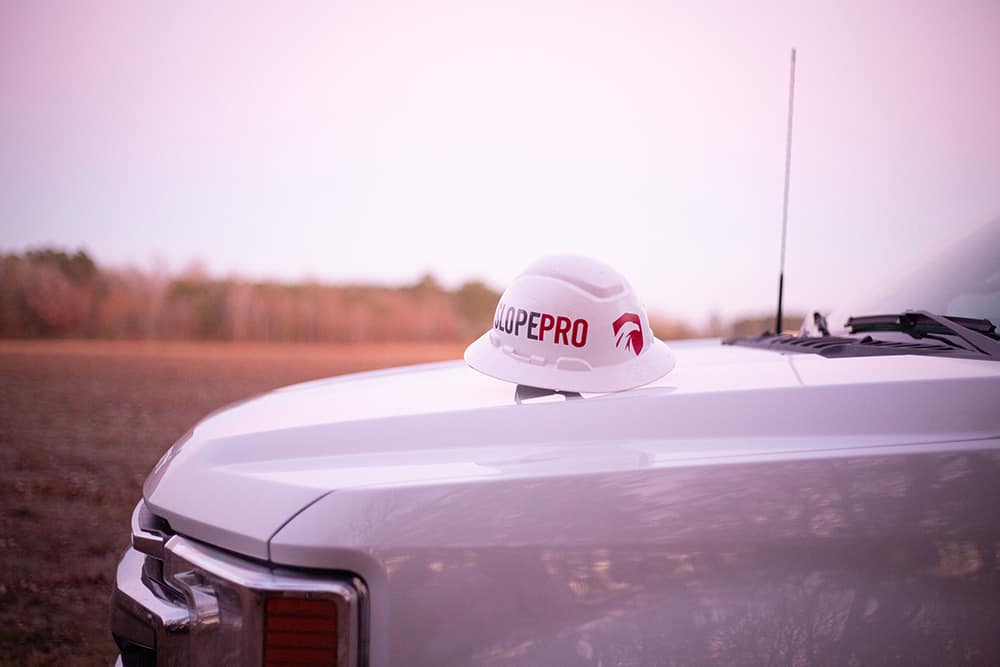 SlopePro helmet on hood of pick-up truck