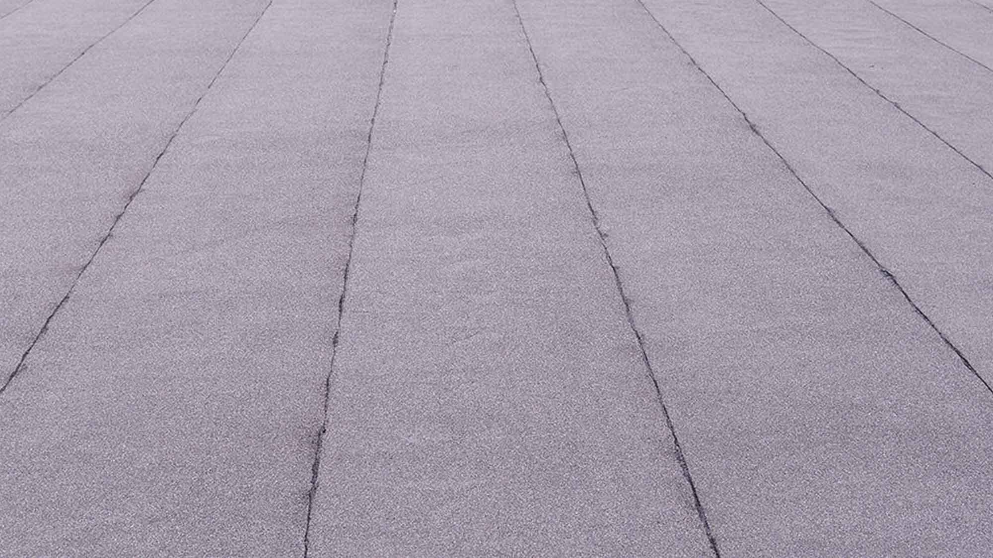 Commercial roof leak repair on a flat low-slope commercial roof